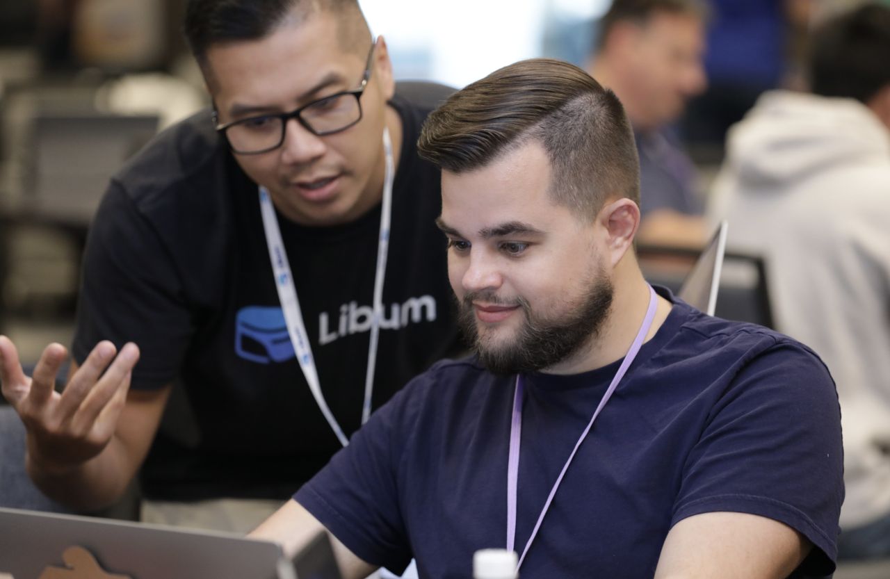 Don Nguyen collaborating with a builder at CU Build